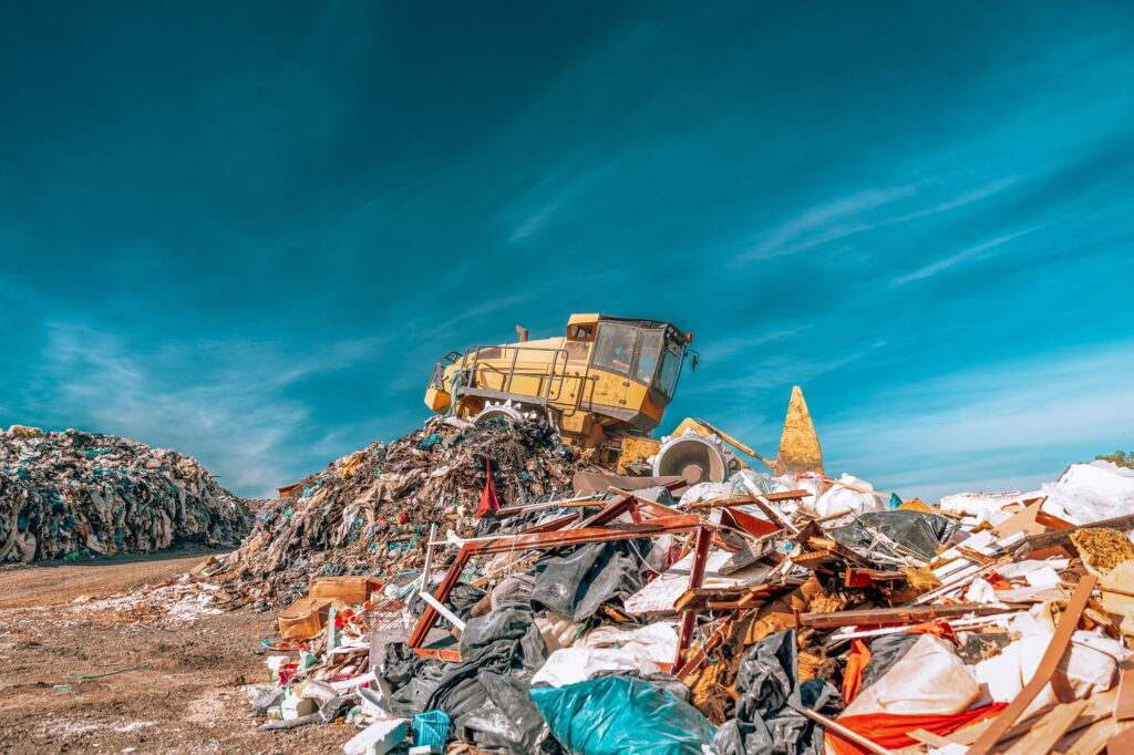 bulldozer compactor working at a landfill.